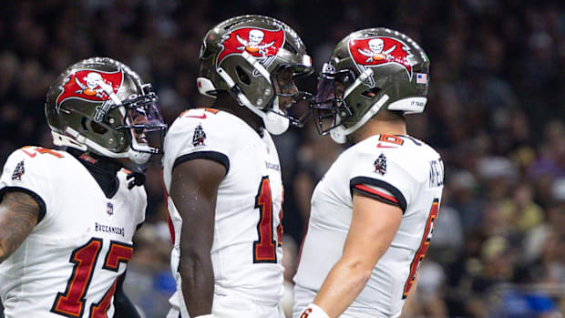 Tampa Bay Buccaneers players are pictured celebrating.