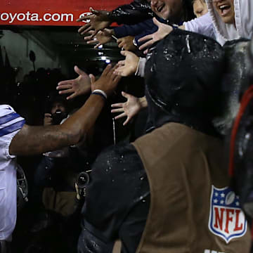Dallas Cowboys quarterback Dak Prescott shakes hands with fans after the Cowboys' game against the Washington Commanders. 