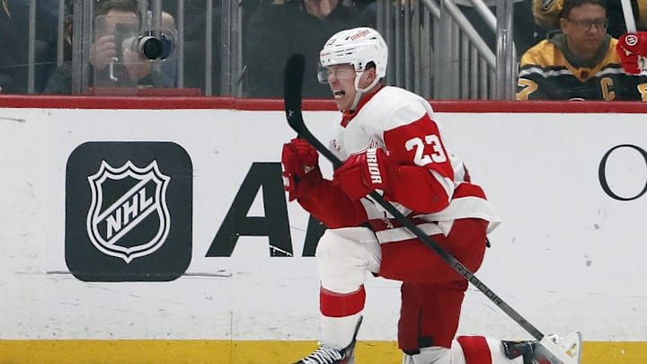 Apr 11, 2024; Pittsburgh, Pennsylvania, USA; Detroit Red Wings left wing Lucas Raymond (23) reacts after scoring a goal to complete a hat-trick against the Pittsburgh Penguins during the third period at PPG Paints Arena. Pittsburgh won 6-5 in overtime. Mandatory Credit: Charles LeClaire-Imagn Images