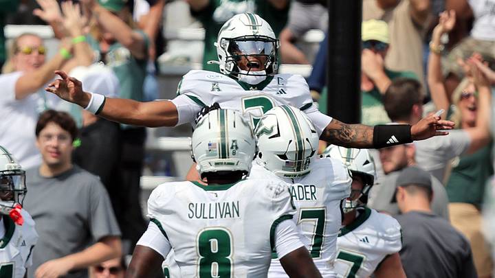 Michael Van Buren celebrates one of his two rushing touchdowns against Army