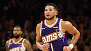Oct 29, 2025; Phoenix, Arizona, USA; Phoenix Suns guard Devin Booker (1) against the Memphis Grizzlies during the second half at the Mortgage Matchup Center. Mandatory Credit: Mark J. Rebilas-Imagn Images