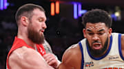 New York Knicks center Karl-Anthony Towns looks to post up against Toronto Raptors forward Sandro Mamukelashvili.
