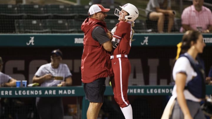 Jenna Johnson celebrates a big play with manager Patrick Murphy. 