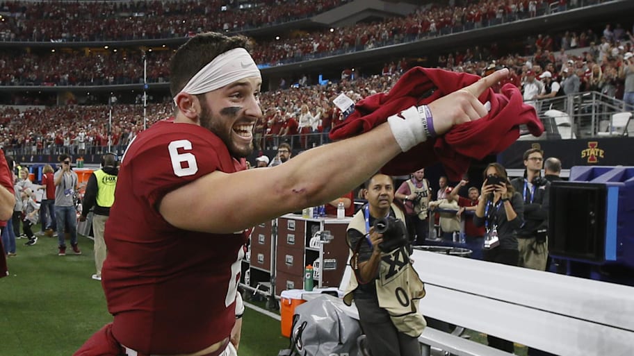 Oklahoma Sooners quarterback Baker Mayfield points to the stands after winning the Big 12 Championship game. | Tim Heitman-Imagn Images