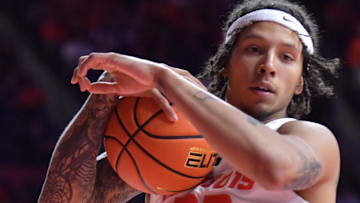 Nov 23, 2024; Champaign, Illinois, USA;  Illinois Fighting Illini guard Tre White (22) pulls down a rebound against the Maryland-Eastern Shore Hawks during the second half at State Farm Center. Mandatory Credit: Ron Johnson-Imagn Images