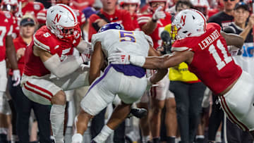 Nebraska defenders John Bullock and Cameron Lenhardt combine to bring down Northern Iowa running back Amauri Pesek-Hickson.