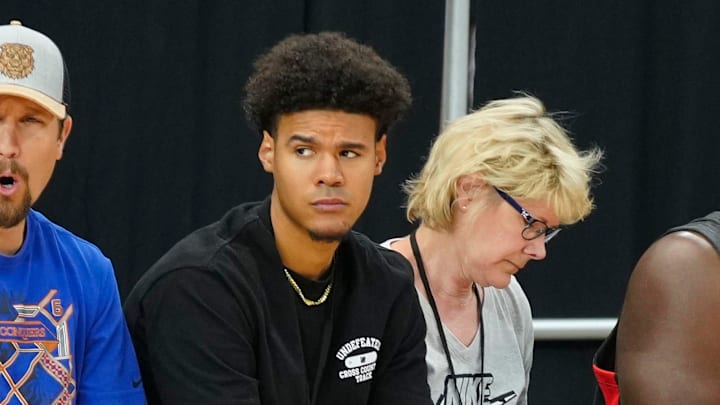 Nets forward Cam Johnson (center) watches his brother Braylon Johnson play for Pinnacle during the Section 7 Basketball Tournament at State Farm Stadium in Glendale on June 23, 2023.