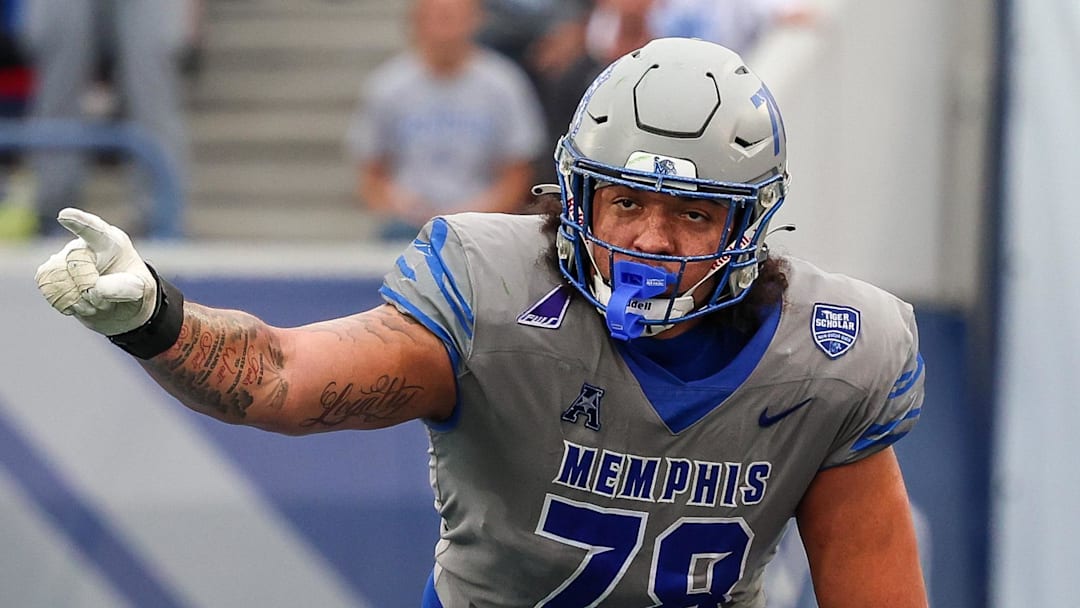 Oct 25, 2025; Memphis, Tennessee, USA; Memphis Tigers offensive lineman Travis Burke (78) gestures toward the South Florida Bulls defense on the line of scrimmage during the second half at Simmons Bank Liberty Stadium. Mandatory Credit: Wesley Hale-Imagn Images Oct 25, 2025; Memphis, Tennessee, USA; Memphis Tigers offensive lineman Travis Burke (78) gestures toward the South Florida Bulls defense on the line of scrimmage during the second half at Simmons Bank Liberty Stadium. Mandatory Credit: Wesley Hale-Imagn Images