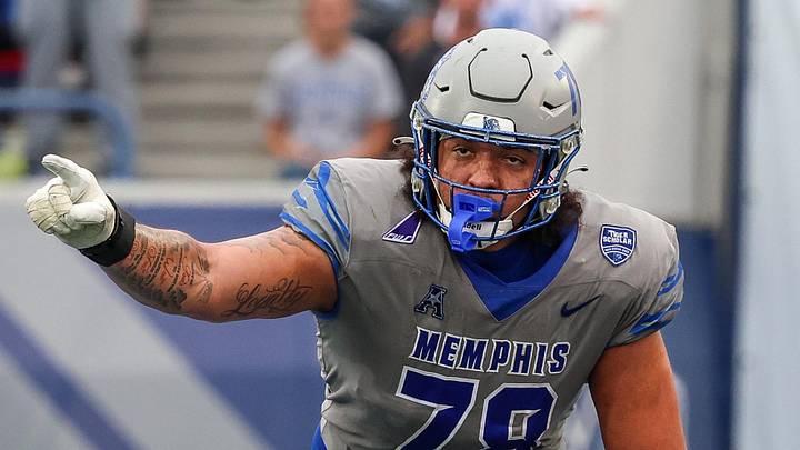 Oct 25, 2025; Memphis, Tennessee, USA; Memphis Tigers offensive lineman Travis Burke (78) gestures toward the South Florida Bulls defense on the line of scrimmage during the second half at Simmons Bank Liberty Stadium. Mandatory Credit: Wesley Hale-Imagn Images