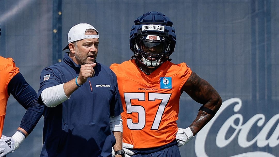 Jul 24, 2025; Englewood, CO, USA; Denver Broncos inside linebackers coach Jeff Schmedding with linebacker Levelle Bailey (56) and linebacker Justin Strnad (40) and linebacker Drew Sanders (41) and linebacker Dre Greenlaw (57) 