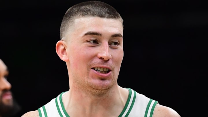 Jan 26, 2026; Boston, Massachusetts, USA; Boston Celtics guard Payton Pritchard (11) and Portland Trail Blazers center Robert Williams III (35) interact during the second half at TD Garden. Mandatory Credit: Bob DeChiara-Imagn Images