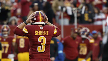 Nov 24, 2024; Landover, Maryland, USA; Washington Commanders place kicker Austin Seibert (3) reacts after missing a potential game-tying extra point in the final minute against the Dallas Cowboys during the fourth quarter at Northwest Stadium. Mandatory Credit: Geoff Burke-Imagn Images