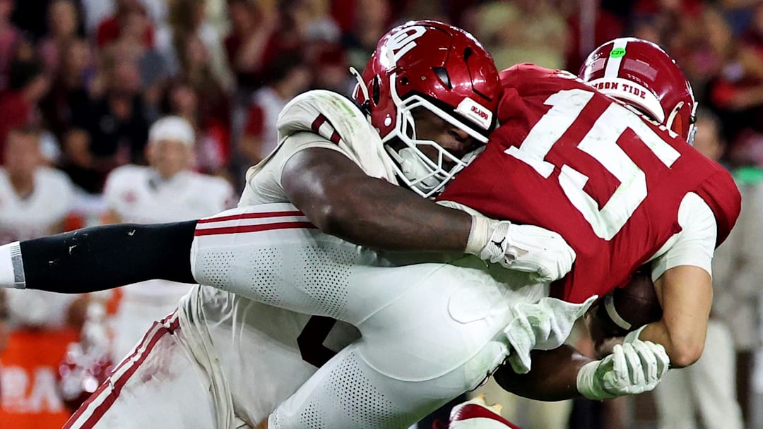 Alabama Crimson Tide quarterback Ty Simpson (15) is tackled by Oklahoma Sooners defensive lineman David Stone (0) Alabama Crimson Tide quarterback Ty Simpson (15) is tackled by Oklahoma Sooners defensive lineman David Stone (0)