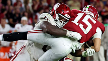 Alabama Crimson Tide quarterback Ty Simpson (15) is tackled by Oklahoma Sooners defensive lineman David Stone (0) 