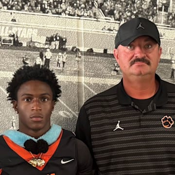 Cocoa High football, coached by Ryan Schneider (third from right), will go for a fourth consecutive state championships this fall. Cocoa, which has won seven titles overall, is one of the state's premier programs.