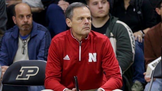 Nebraska head coach John Cook reacts from the bench during the second set of an NCAA women's volleyball game
