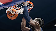 Dec 31, 2024; Lawrence, Kansas, USA; West Virginia Mountaineers center Eduardo Andre (0) dunks the ball during the first half against the Kansas Jayhawks at Allen Fieldhouse. Mandatory Credit: Jay Biggerstaff-Imagn Images