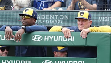 May 25, 2025; Pittsburgh, Pennsylvania, USA;  Milwaukee Brewers associate manager Rickie Weeks Jr. (left) and manager Pat Murphy (right) look on over the dugout railing against the Pittsburgh Pirates during the ninth inning at PNC Park. Mandatory Credit: Charles LeClaire-Imagn Images
