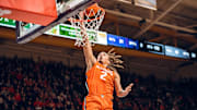 Illinois guard Dra Gibbs-Lawhorn (2) finishes at the rim in the Illini's 80-77 win over Washington on Sunday at Alaska Airlines Arena in Seattle.