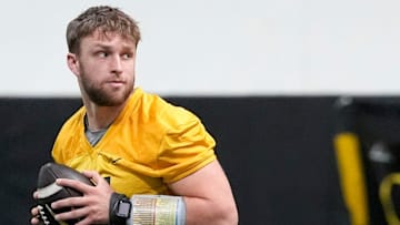 Iowa quarterback Mark Gronowski (11) walks through a drill at practice Thursday, April 3, 2025 in Iowa City, Iowa.