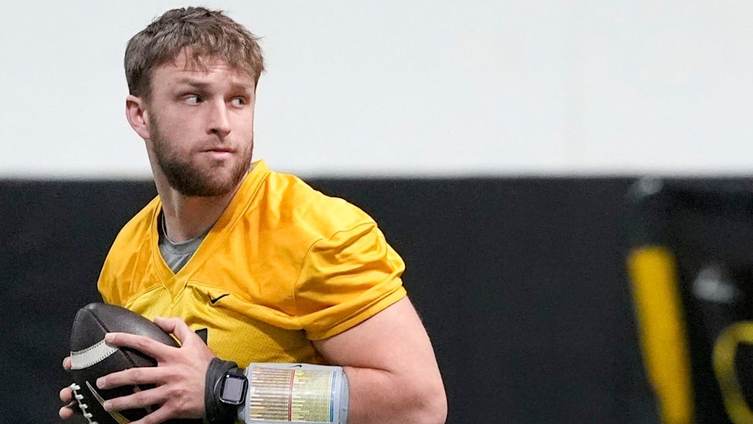 Iowa quarterback Mark Gronowski (11) walks through a drill at practice Thursday, April 3, 2025 in Iowa City, Iowa.