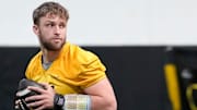 Iowa quarterback Mark Gronowski (11) walks through a drill at practice Thursday, April 3, 2025 in Iowa City, Iowa.