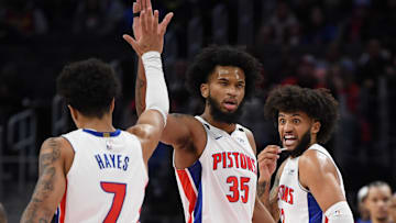 Nov 27, 2022; Detroit, Michigan, USA;  Detroit Pistons guard Killian Hayes (7) celebrates with Marvin Bagley III and Isaiah Livers