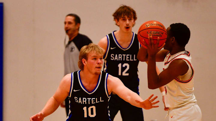 Sartell boys basketball senior Brayden Simones plays defense during a 2024 Granite City Classic game Dec. 27 at home versus Osseo. The Sabres won 60-55.