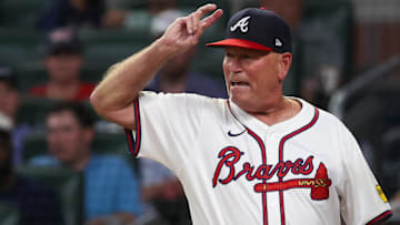 Atlanta Braves manager Brian Snitker (43) reacts to umpire Brian Walsh (120) after being ejected from a game against the Milwaukee Brewers in the fifth inning at Truist Park.