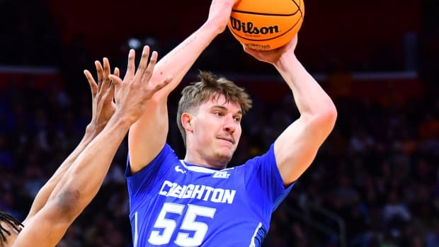 Creighton guard Baylor Scheierman (55) is defended by Tennessee guard Josiah-Jordan James (30) during a NCAA Tournament Sweet 16 game between Tennessee and Creighton held at Little Caesars Arena in Detroit on Friday, March 29, 2024.