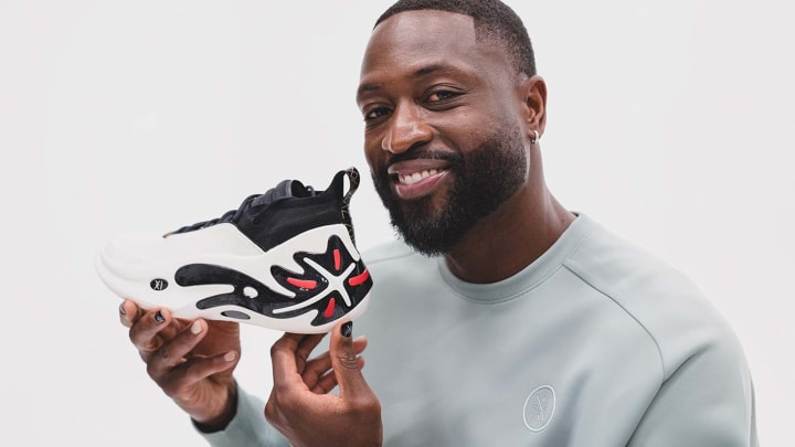 Dwayne Wade holds the Way of Wade 11.