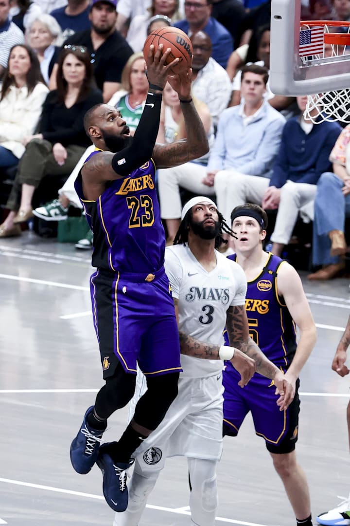 Los Angeles Lakers forward LeBron James shoots past Dallas Mavericks forward Anthony Davis. 