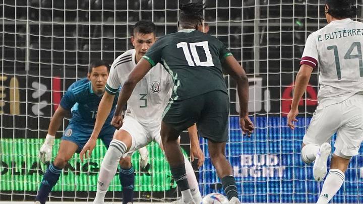 May 28, 2022; Arlington, TX, USA; Nigeria midfielder Joe Aribo (10) controls the ball against Mexico defender Cesar Jason Montes Castro (3) during the second half at AT&T Stadium. Mandatory Credit: Chris Jones-Imagn Images