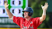 COTUIT 06/21/24 Max Belyeu of Cotuit celebrates a after arriving at second a double against Hyannis. Cape League baseball