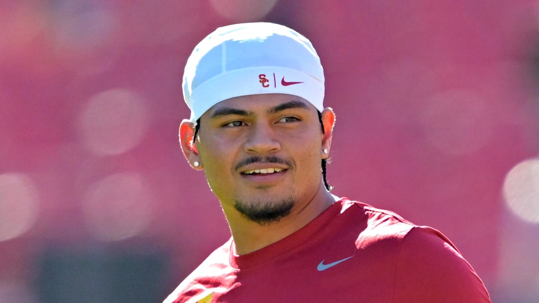 Oct 11, 2025; Los Angeles, California, USA;  USC Trojans quarterback Jayden Maiava (14) warms up prior to the game against the Michigan Wolverines at United Airlines Field at the Los Angeles Memorial Coliseum. Mandatory Credit: Jayne Kamin-Oncea-Imagn Images