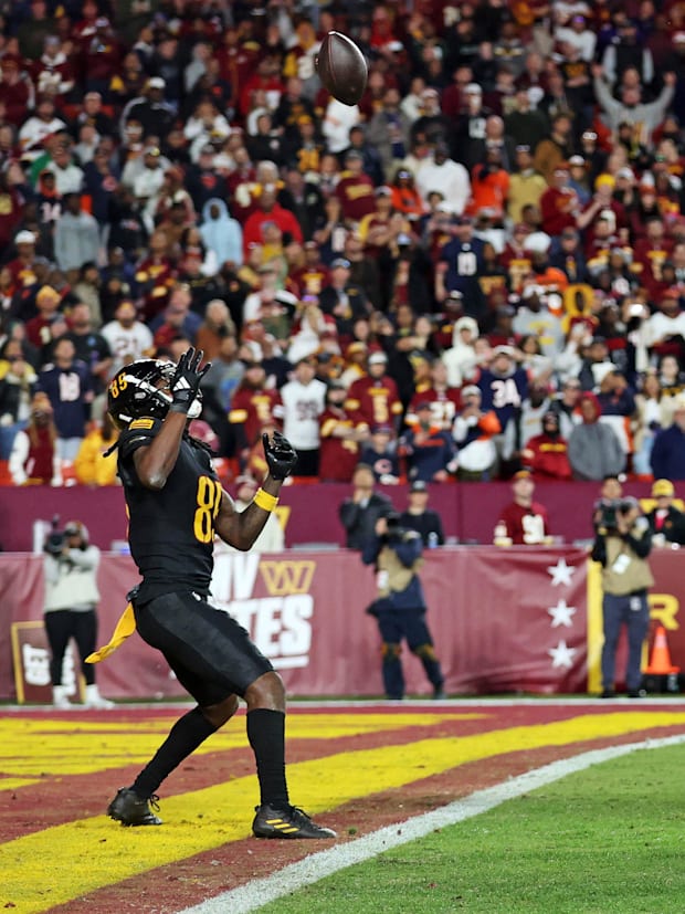 Washington Commanders wide receiver Noah Brown (85) catches a Hail Mary pass.