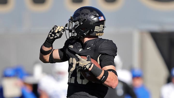 Nov 2, 2024; West Point, New York, USA; Army Black Knights defensive back Casey Larkin (20) celebrates his interception against the Air Force Falcons during the second half at Michie Stadium. Nov 2, 2024; West Point, New York, USA; Army Black Knights defensive back Casey Larkin (20) celebrates his interception against the Air Force Falcons during the second half at Michie Stadium.