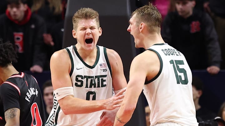 Jan 27, 2026; Piscataway, New Jersey, USA; Michigan State Spartans forward Jaxon Kohler (0) reacts with center Carson Cooper (15) after scoring a basket during overtime against the Rutgers Scarlet Knights at Jersey Mike's Arena. Mandatory Credit: Vincent Carchietta-Imagn Images