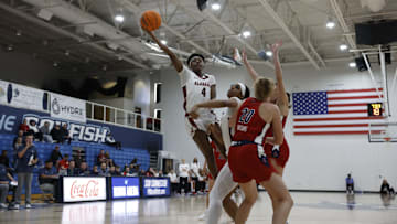 Eris Lester going up for a tough finish against Richmond.