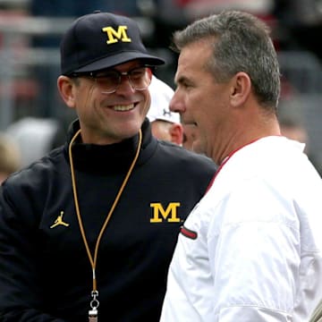 Urban Meyer discussed Jim Harbaugh's NCAA suspension and whether it should translate to the NFL.