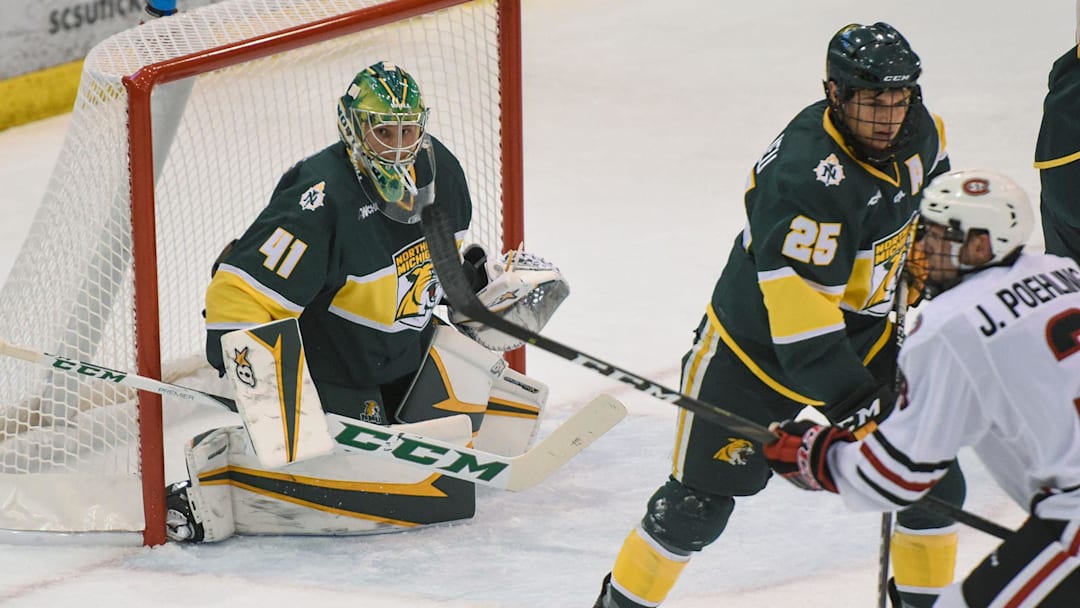 A shot by St. Cloud State's Jack Poehling bounces wide of the Northern Michigan goal during the first period of the Friday, Oct. 19, game at the Herb Brooks National Hockey Center in St. Cloud. 

Scsu Hock Edits 10