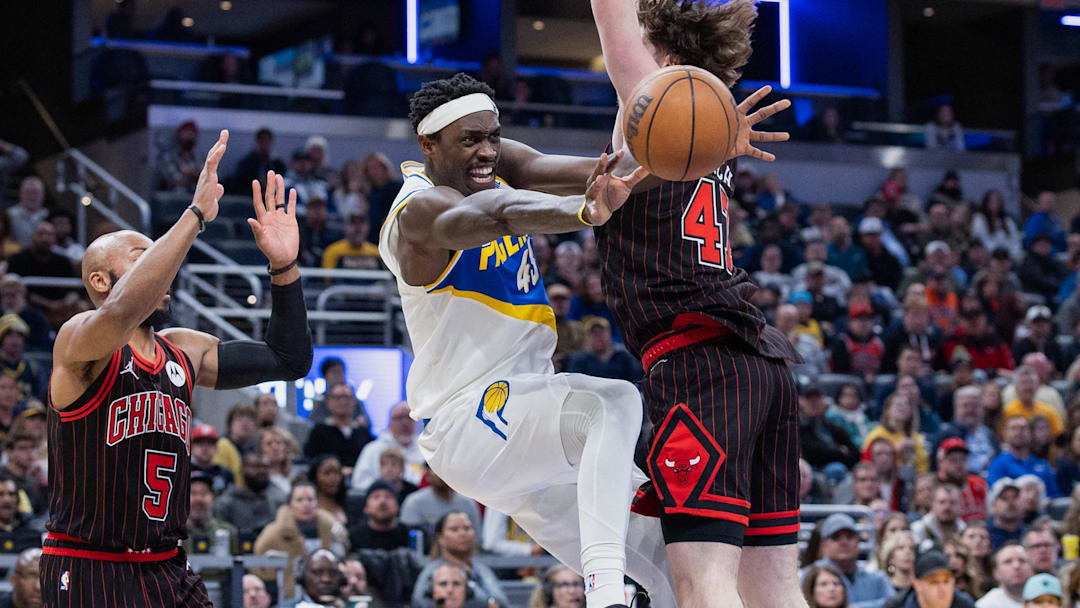 Nov 29, 2025; Indianapolis, Indiana, USA; Indiana Pacers forward Pascal Siakam (43) reacts as he passes the ball against Chicago Bulls center Lachlan Olbrich (47) and guard Jevon Carter (5) (obscured) during the second half at Gainbridge Fieldhouse. Mandatory Credit: Trevor Ruszkowski-Imagn Images