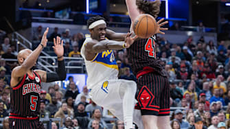 Nov 29, 2025; Indianapolis, Indiana, USA; Indiana Pacers forward Pascal Siakam (43) reacts as he passes the ball against Chicago Bulls center Lachlan Olbrich (47) and guard Jevon Carter (5) (obscured) during the second half at Gainbridge Fieldhouse. Mandatory Credit: Trevor Ruszkowski-Imagn Images