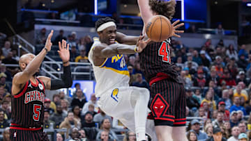 Nov 29, 2025; Indianapolis, Indiana, USA; Indiana Pacers forward Pascal Siakam (43) reacts as he passes the ball against Chicago Bulls center Lachlan Olbrich (47) and guard Jevon Carter (5) (obscured) during the second half at Gainbridge Fieldhouse. Mandatory Credit: Trevor Ruszkowski-Imagn Images