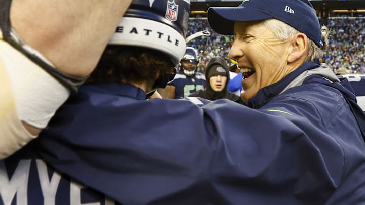 Jan 8, 2023; Seattle, Washington, USA; Seattle Seahawks head coach Pete Carroll hugs place kicker Jason Myers (5) following a 19-16 overtime victory against the Los Angeles Rams at Lumen Field.