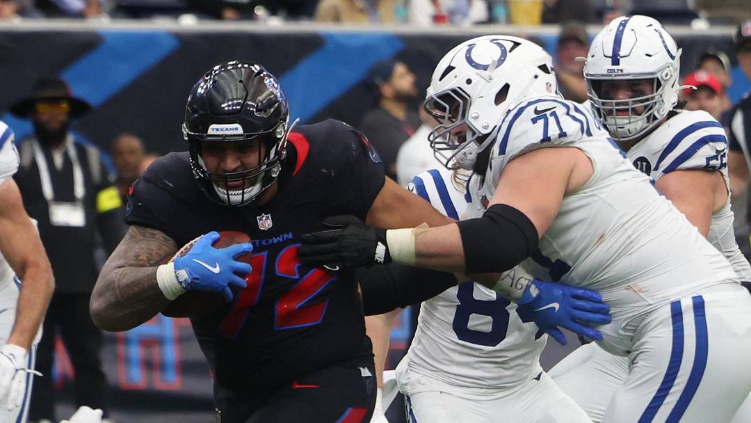 Jan 4, 2026; Houston, Texas, USA;  Houston Texans defensive tackle Tommy Togiai (72) carries the ball for a touchdown after recovering a fumble against the Indianapolis Colts during the second half at NRG Stadium. Mandatory Credit: Thomas Shea-Imagn Images