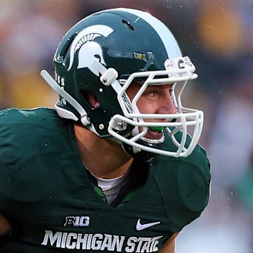Nov 2, 2013; East Lansing, MI, USA; Michigan State Spartans linebacker Max Bullough (40) before the snap of the ball during the 2nd half of a game against the Michigan Wolverines at Spartan Stadium. MSU won 29-6. Mandatory Credit: Mike Carter-Imagn Images
