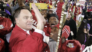 Nov. 23, 2007; Baton Rouge, LA, USA; Arkansas Razorbacks head coach Houston Nutt celebrates with his team after their 50-48 triple overtime victory over the top ranked LSU Tigers at Tiger Stadium. Mandatory Credit: John David Mercer-Imagn Images Copyright © 2007 John David Mercer