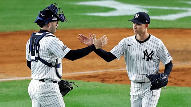 Yankees catcher Austin Wells, left, and pitcher Luke Weaver