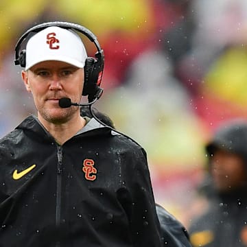 Nov 15, 2025; Los Angeles, California, USA; Southern California Trojans head coach Lincoln Riley watches game action against the Iowa Hawkeyes during the first half at the Los Angeles Memorial Coliseum. Mandatory Credit: Gary A. Vasquez-Imagn Images